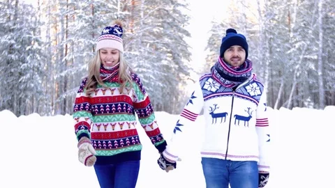 Portrait of nice couple walking in the winter forest Видео 71259074