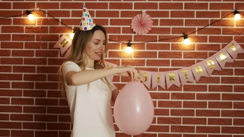 Portrait of nice lady blowing pink baloon festal event celebratory day Stock Footage 154106137