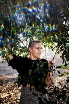 Portrait of Non Binary Person with Shaved Head in San Diego Foto stock