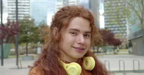 Portrait of non-binary teenager looking at camera smiling. Millennials Stock Footage 243439239