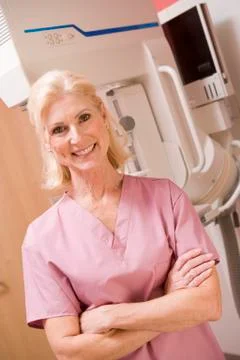 Portrait of a nurse in front of a mammogram machine Stock Photos