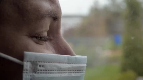Portrait nurse with protective face mask tearful gaze Vídeo Stock 332873492