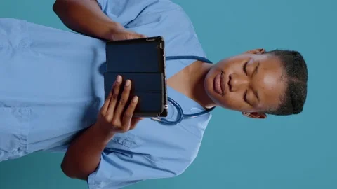 Portrait of nurse working on digital tablet with touch screen Stock Footage 171324007