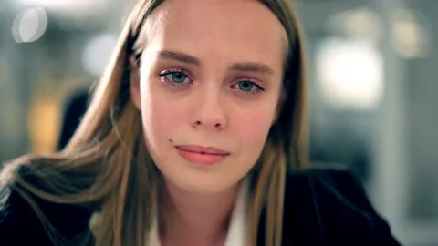 Portrait of an office worker crying at the workplace Stock Footage 235943310