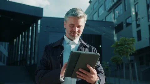 Portrait office worker using his tablet computer - scrolling, taping and texting Stock Footage 166693532