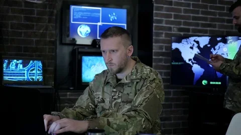 Portrait officer men in camouflage uniform, in system control center, cyber Stock Footage