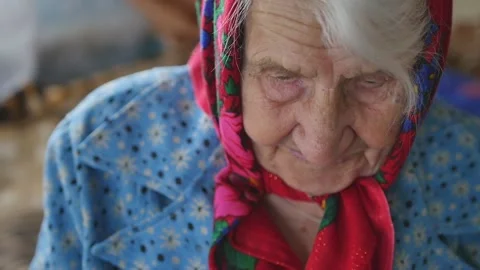 Portrait of an old gray-haired grandmother. Close-up. Stock Footage