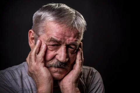Portrait of an old gray-haired man with a mustache Stock Photos