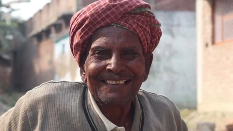 Portrait of an old man Asian Indian villager smiling and showing happy gesture. Stock Footage