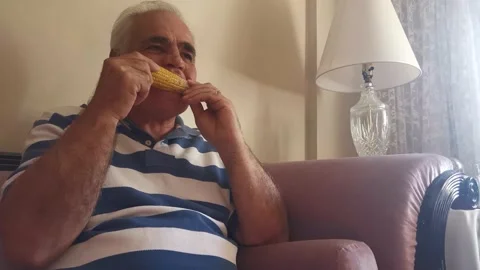 Portrait Of Old Man Eating Corn 4 Video stock 142631254