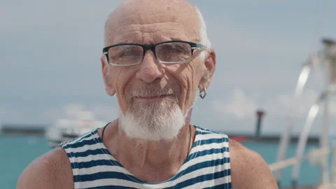 Portrait of the old man sailor with white beard and ring in the ear Stock-Footage 337991690