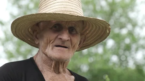 Portrait of old man with tired wrinkled face in straw hat Stock Footage 201552247