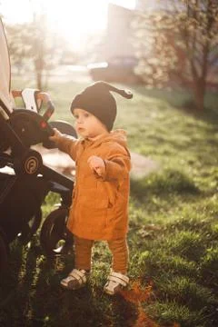 Portrait of a one year old boy with a snail wool cap Stock Photos