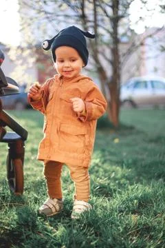 Portrait of a one year old boy with a snail wool cap Stock Photos