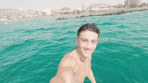 Portrait of one young man falling and sliding to the water with eyes closed enjo Stock Footage 171894664