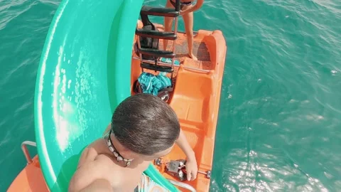 Portrait of one young man falling and sliding to the water with eyes closed enjo Stock Footage 171898976