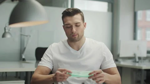 Portrait of an open office worker in a spacious office with computers. The man Stock Footage 150335433