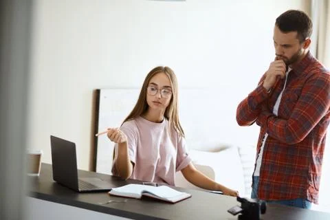 Portrait of ouple solving problems 写真素材