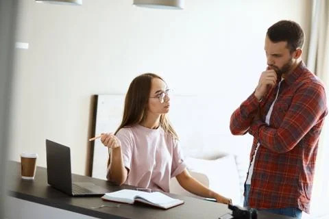Portrait of ouple solving problems 写真素材