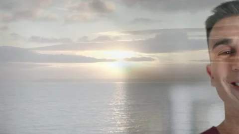Portrait overlay appearing over ocean, smiling man blinking as sun reflection Stock Footage 333720018