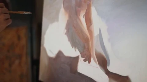 Portrait of painter in art studio. professional artist paints the picture of a Stock Footage 74291524
