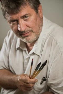Portrait of a painter in his workshop Stock Photos