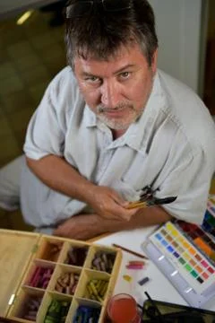 Portrait of a painter in his workshop Stock Photos