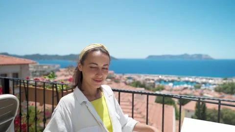 Portrait with parallax effect of young mixed race smiling woman sitting on open Stock Footage 202644648