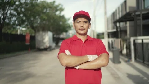 Portrait. A parcel delivery worker dressed Stock Footage 243070651