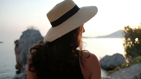 Portrait of passionate brunette in a hat, which looks a piercing gaze. Stock Footage 79861585