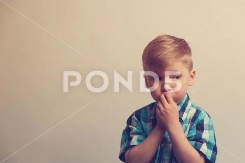 Portrait of pensive caucasian child Stock Photos
