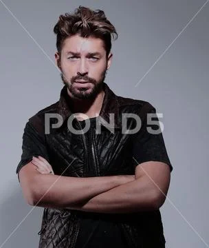 Portrait of a pensive handsome man over gray background Stock Photos