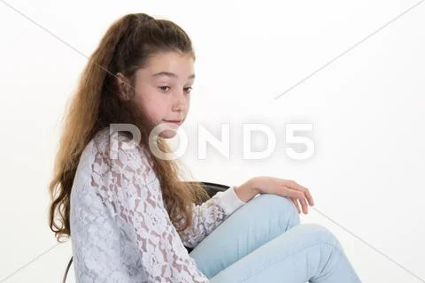 Portrait of pensive teen girl isolated in white Stock Photos