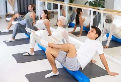 Portrait of people practicing Matsyendrasana known as Lord of Fishes Pose during Stock Photos