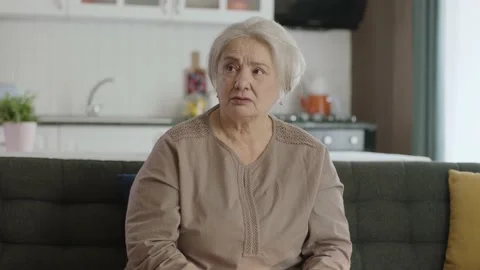 Portrait of a pessimistic disturbed suspicious old woman. Stock Footage 190020900