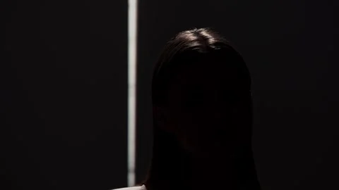 Portrait Photography with Dramatic Shadows and Light Beam Stock Footage 310498023