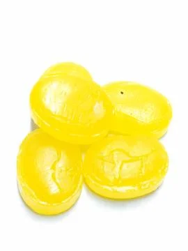 A portrait picture of mango flavour candy's on white background Foto stock