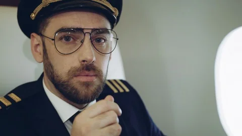 Portrait of pilot while waiting the flight inside the private jetplane. RED Stock Footage 111065935