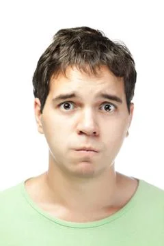 Portrait of pitiful young man isolated on white background Stock Photos
