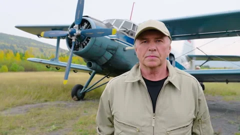 Portrait of a plane pilot waiting for the passengers to enter the aircraft Stock Footage 271591479