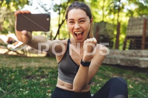 Portrait of a playful young fitness girl taking a selfie Stock Photos