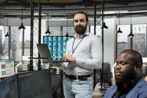 Portrait of pleased manager utilizing data reports and tools to build vision Stock Photos