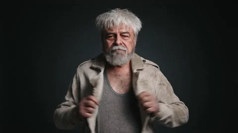 Portrait of poor man with gray beard looking at camera Stock Footage 229232555