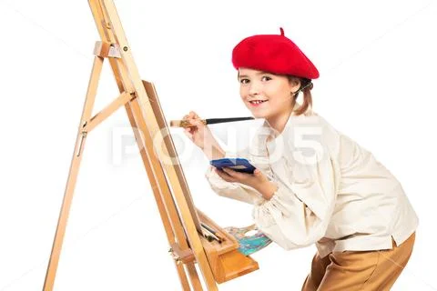 A portrait of a positive girl painting a picture. Creativity, artist. Stock Photos
