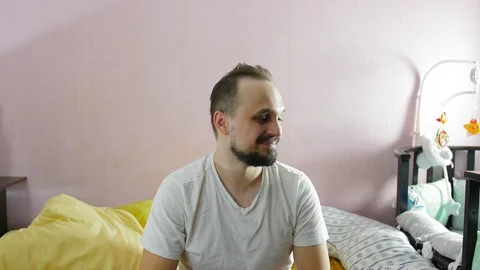 Portrait of positive young man looking in camera and making grimaces at home. Stock Footage 124932087