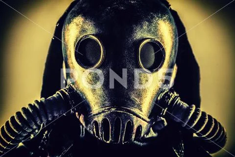Portrait of post apocalyptic survivor in gas mask Stock Photos