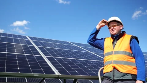 Portrait of a power engineer standing on a stepladder with a helmet Stock Footage 168178554