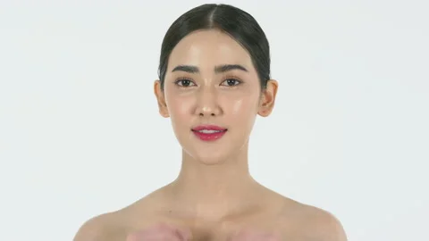 Portrait pretty Asian young woman touching face and healthy white background Stock Footage 133620833