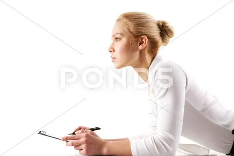 Portrait of pretty businesswoman thinking while planning work Stock Photos