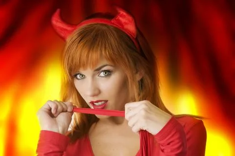 Portrait of a pretty devil Stock Photos